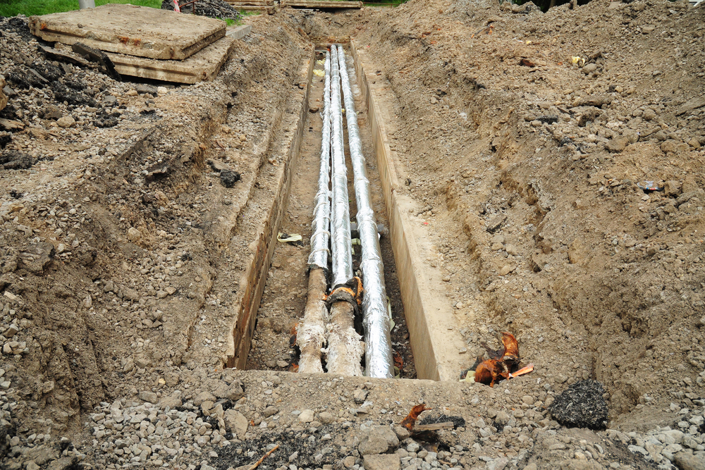 Breakthrough sewerage system.Pipes for water in an earthen trench. Repair and replacement of sewer.