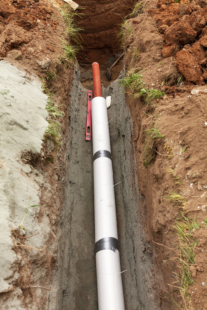 Installation of water main, sanitary sewer, storm drain systems, plastic pipes wrapped in insulation